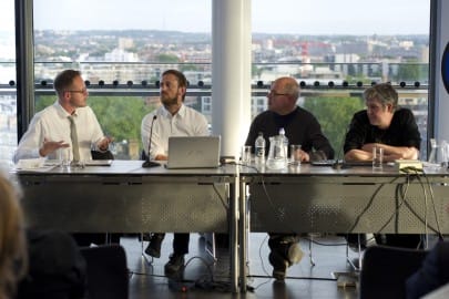 Panel of speakers at event