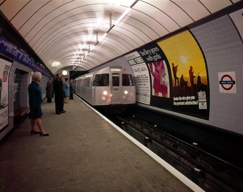 Seven Sisters Underground station platform, Victoria line. A Victoria-bound train of 1967-tube stock, 
headed by driving motor car no.3143 draws into the station. A few (posed) passengers are waiting. A 
seating recess with tiled motif can be seen in the foreground, 1969
Photograph Dr Heinz Zinram